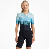 Woman wearing a blue and black Triathlon suit on a white background